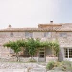 Elegant stone house surrounded by greenery, perfect for a romantic wedding in Provence. This private estate offers a sophisticated setting for a grand ceremony, ideal for a unique celebration. With its lush gardens and peaceful atmosphere, it&#039;s the ideal location for a tailor-made luxury wedding. By Mademoiselle C transforms every event into an unforgettable experience, making every detail a reflection of love and elegance.