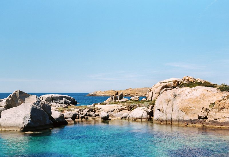 An enchanting coastal landscape, perfect for a romantic wedding, featuring crystal-clear waters and majestic rocks. This unique setting is ideal for a grand celebration or a bespoke event, orchestrated by By Mademoiselle C. Imagine a luxury wedding on the French Riviera, where every detail is designed to create an unforgettable experience. Sea views add a touch of sophistication.