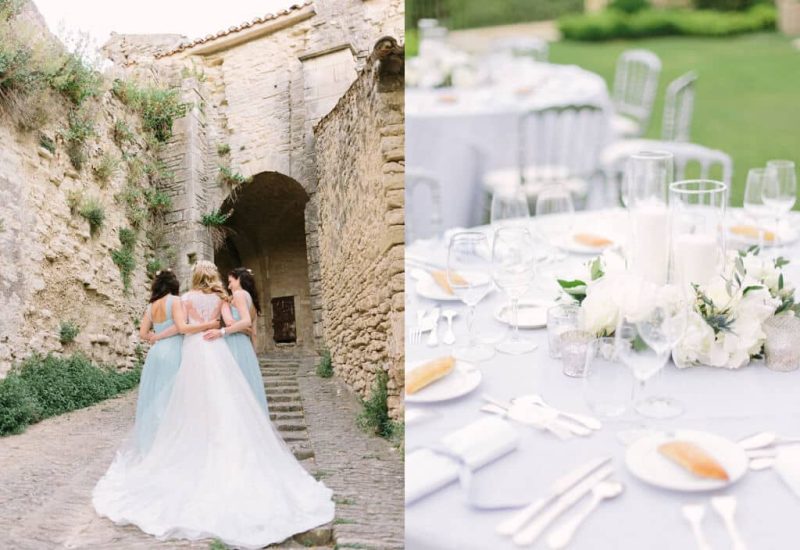 Three elegant brides stand side by side in a picturesque alleyway, evoking a romantic atmosphere for a luxury wedding in Provence, the French Riviera and Corsica. Their delicate gowns and the historic setting underline the uniqueness of their celebration. Nearby, a beautifully laid table, adorned with white flowers and candles, illustrates the tailor-made organization of an exceptional event.