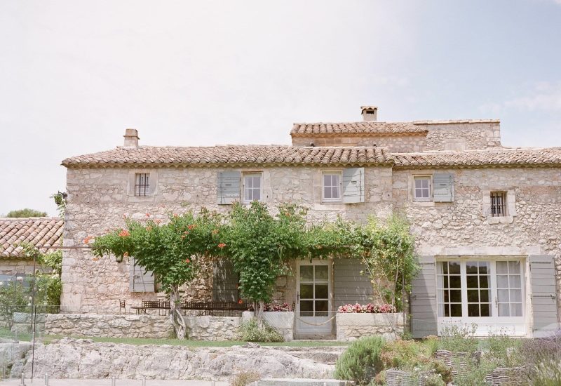 Elegant stone house surrounded by greenery, perfect for a romantic wedding in Provence. This private estate offers a sophisticated setting for a grand ceremony, ideal for a unique celebration. With its lush gardens and peaceful atmosphere, it's the ideal location for a tailor-made luxury wedding. By Mademoiselle C transforms every event into an unforgettable experience, making every detail a reflection of love and elegance.