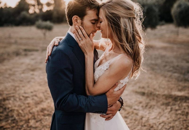 A couple in love embrace, surrounded by the natural beauty of the fields in Provence, evoking a romantic and elegant mood. This captured moment perfectly illustrates By Mademoiselle C's expertise as a wedding planner in Provence, the French Riviera and Corsica. With meticulous attention to detail, each wedding is designed as a unique, bespoke event, ideal for a grand celebration or a dream wedding. Landscapes as a backdrop
